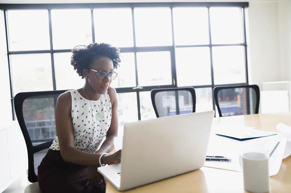 person working on laptop at a table to represent independent contractors