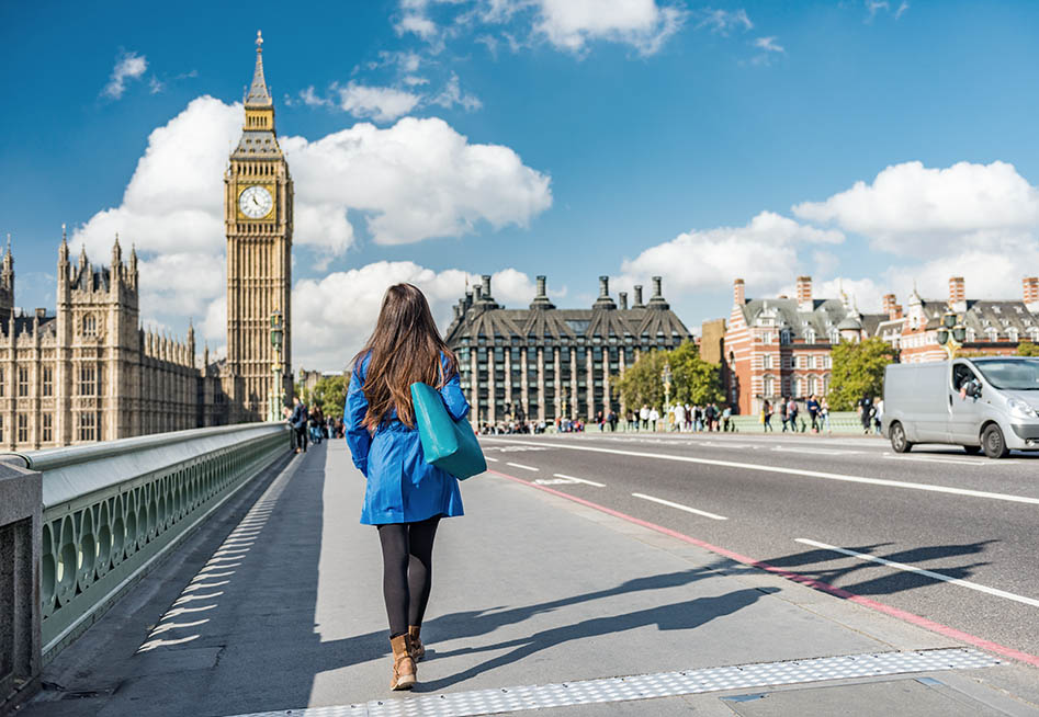Image of woman walking in london representing an employee working overseas but still accruing long service leave