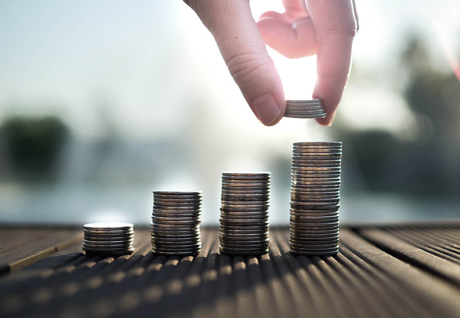Stacks of coins representing high income workers