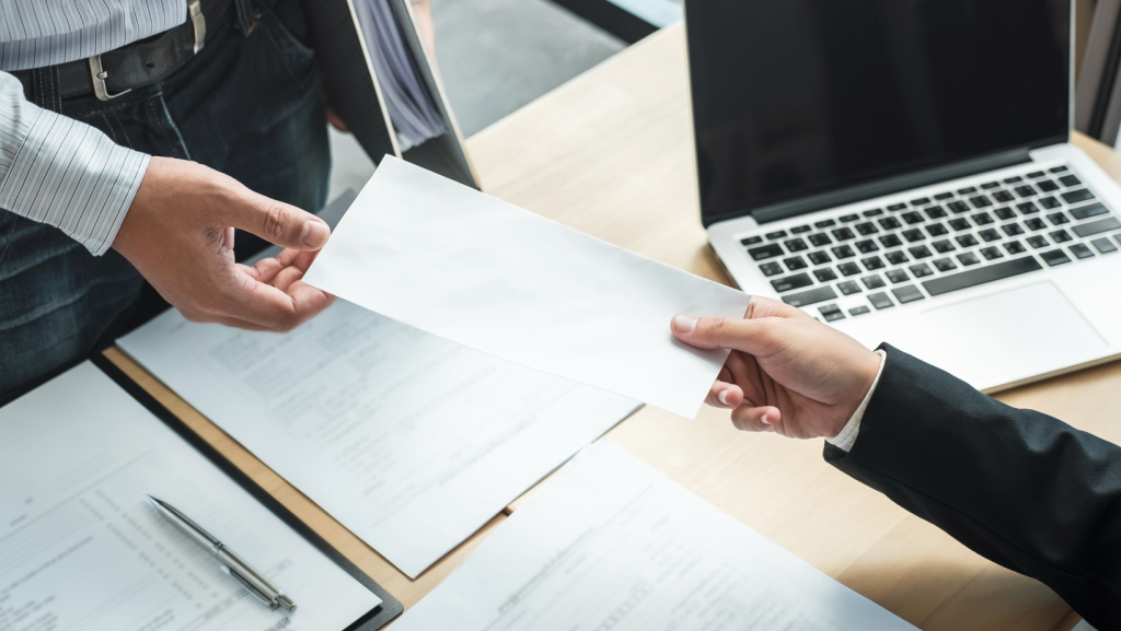 Employee handing in resignation to indicate start of notice period